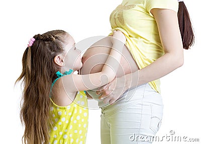 Cute child girl embracing pregnant mother belly Stock Photo