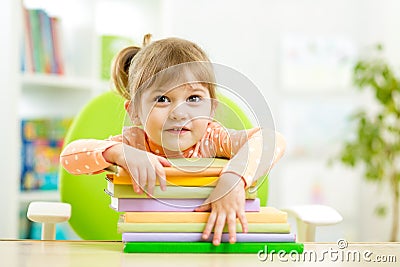 Cute child girl preschooler with books Stock Photo