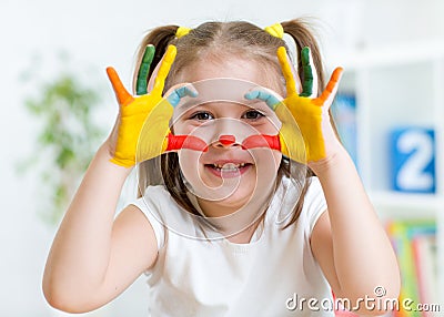 Cute child have fun painting her hands Stock Photo