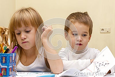 Cute children painting pictures at table indoors Stock Photo