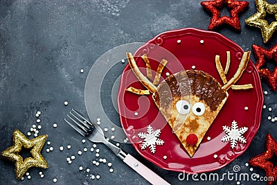 Cute Christmas food idea - funny reindeer pancake Stock Photo