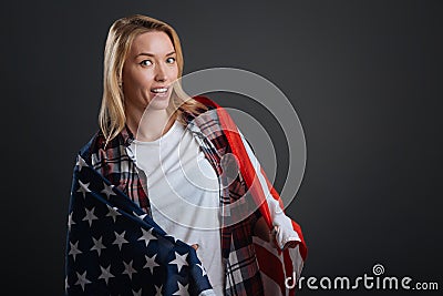 Cute confident lady posing with the national flag Stock Photo