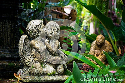 Cute couple cupid Statue in the garden Stock Photo