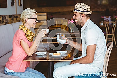 Cute couple on a date talking over a cup of coffee Stock Photo