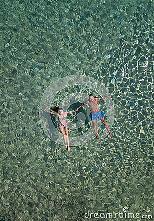 Cute couple floating in the sea Stock Photo