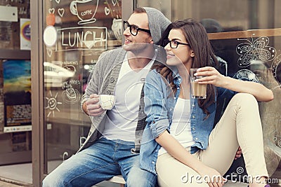 Cute couple outside of cafe Stock Photo