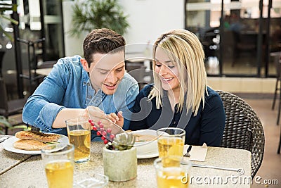Cute couple sharing some food Stock Photo
