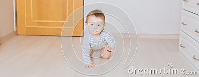 Cute crawling funny baby boy indoors at home Stock Photo