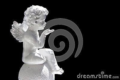 Cute cupid angel over black background Stock Photo