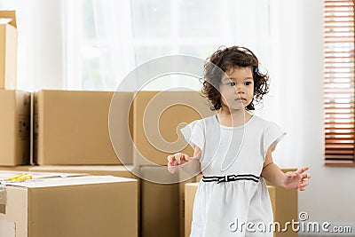 Cute daughter in the house. Family just moving new house many parcel box on the floor Stock Photo