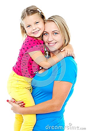 Cute daughter hugging her mom. Casual shot Stock Photo