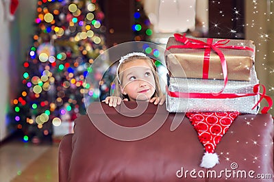 Cute elegant girl celebrate Christmas and New Year with presents Stock Photo