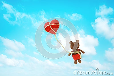 Cute fabric bear with heart in sky Stock Photo