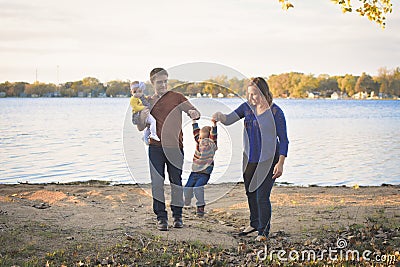 Cute Family by Lake Stock Photo