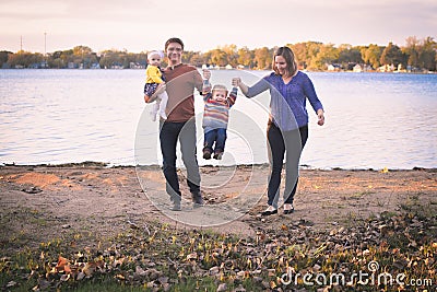 Cute Family by Lake Stock Photo