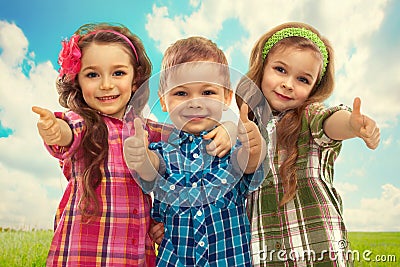 Cute fashion kids showing thumbs up. Stock Photo