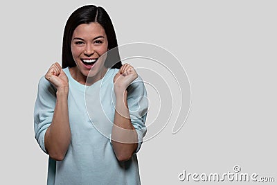 Cute female portrait of a woman thrilled, joyous, excited, celebrating, overjoyed expressive face Stock Photo