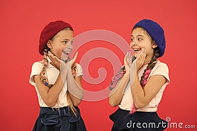 They are really cute. French style girls. Girls having the same hairstyle. Small children with long hair plaits. Fashion Stock Photo