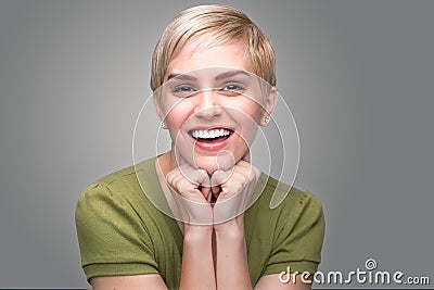Cute fun bubbly adorable personality modern young fresh pixie haircut perfect teeth smile Stock Photo