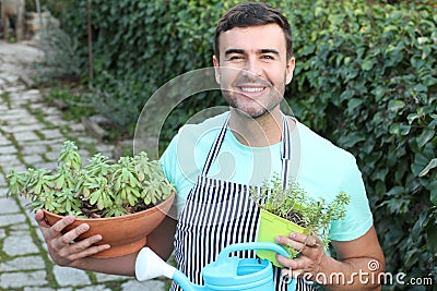 Cute gardener holding succulent plants Stock Photo