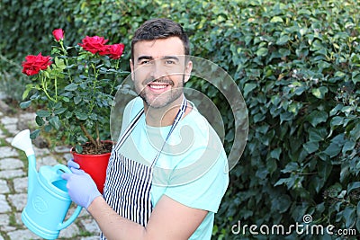 Cute gardener working with roses Stock Photo
