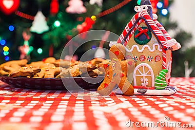 Cute gingerbread man in front of his candy ginger Stock Photo