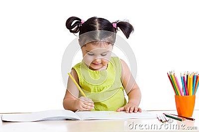Cute girl drawing with colourful pencils Stock Photo