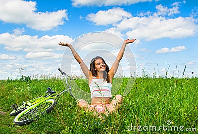 Cute girl enjoys summer after cycling cruiser Stock Photo