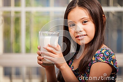 Cute girl with a glass of milk Stock Photo