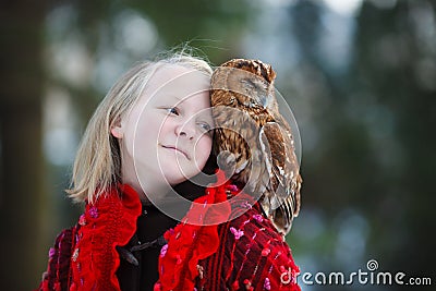 Cute girl with little owl Stock Photo