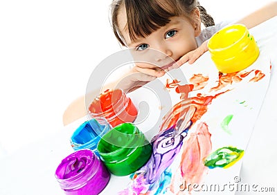 Cute girl painting with finger paints Stock Photo