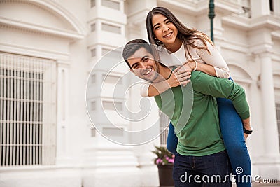 https://thumbs.dreamstime.com/x/cute-girl-piggybacking-her-boyfriend-portrait-good-looking-young-happy-couple-having-fun-piggyback-ride-68072559.jpg