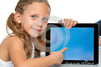 Cute girl pointing on blank tablet screen. Stock Photo