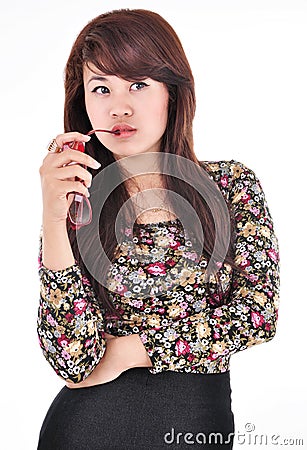 Cute girl posing and biting glasses Stock Photo