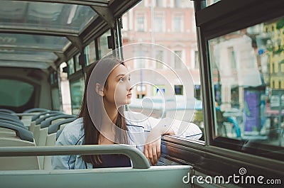 girl rides in the tour bus and looks out the window. Saint Petersburg, Russia. Stock Photo