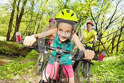 Cute girl riding her mountain bike in the park Stock Photo