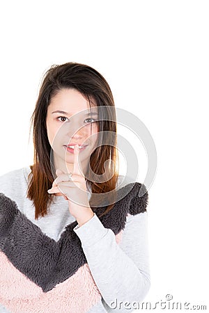 Cute girl showing silence sign holding forefinger on lips having big secret isolated on white background Stock Photo