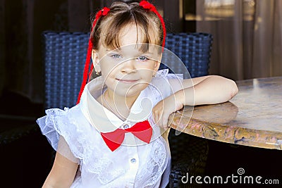 cute girl sitting at a table in kafe in the summer Stock Photo