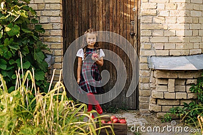 Cute Girl Stand At Wooden Door House Background Stock Photo