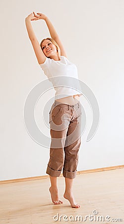 Cute Girl Stretches Stock Photo