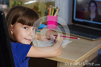 Cute girl studies at home by internet Stock Photo