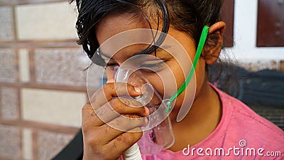 Cute girl suffering from Lungs infection and taking breath in severe flu infection. Stock Photo