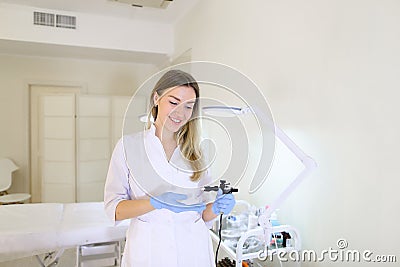 Cute girl tattoo artist browsing eyebrows poses on camera with s Stock Photo