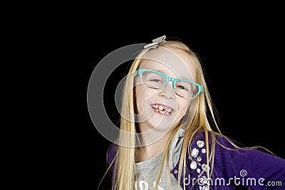 Cute girl wearing funky glasses posing with an attitude Stock Photo