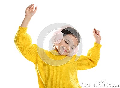 Cute girl wearing stylish earmuffs on white Stock Photo