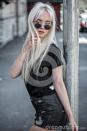 Cute girl wearing in sunglassses outside Stock Photo