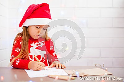 Cute girl writing a letter to Santa, white background Stock Photo