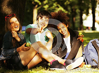 Cute group of teenages at the building of university with books Stock Photo