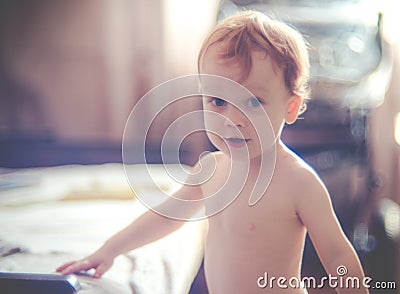 Cute half naked boy in a room Stock Photo