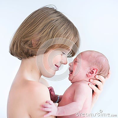 Cute happy boy with his newborn baby brother Stock Photo